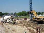 Using cement truck and Nilex rig for treatment zone materials installation