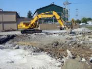 Removing old building floors turned parking lots, and footers and buried bunkers